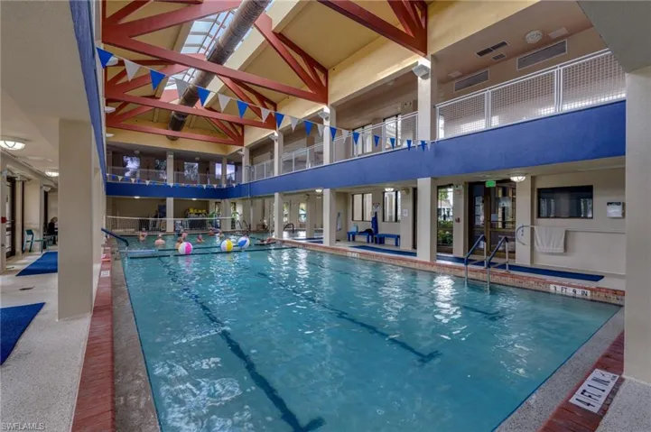 Indoor community pool with a patio area