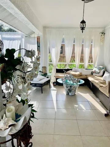 Sunroom / solarium with tile patterned floors