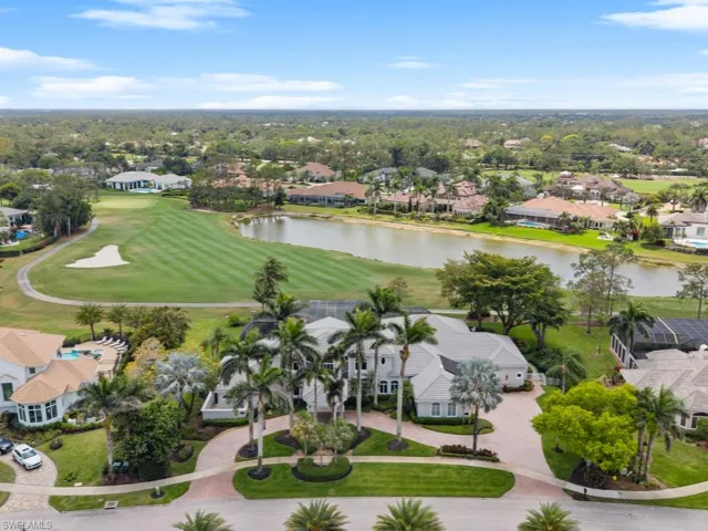 Drone / aerial view featuring a residential view, golf course view, and a water view