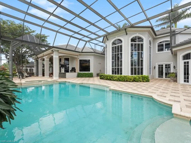 Pool featuring a patio, french doors, and a lanai