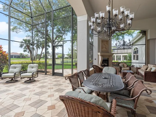 Sunroom with a notable chandelier