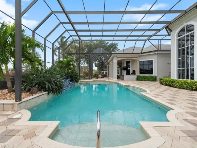 Pool featuring a lanai and a patio