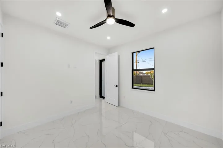 Unfurnished room featuring baseboards, visible vents, recessed lighting, and a ceiling fan