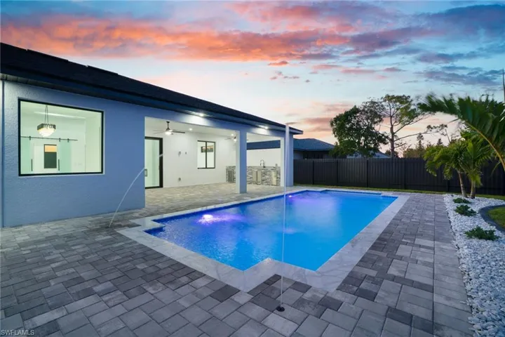 View of pool with a fenced backyard, a fenced in pool, ceiling fan, and a patio area