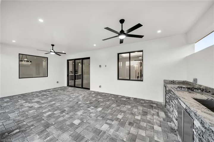 View of patio featuring ceiling fan