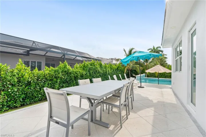 View of patio / terrace featuring glass enclosure