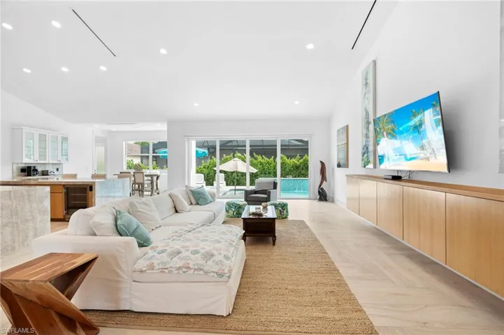 Living room featuring wine cooler and light parquet floors