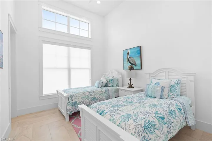 Bedroom featuring multiple windows