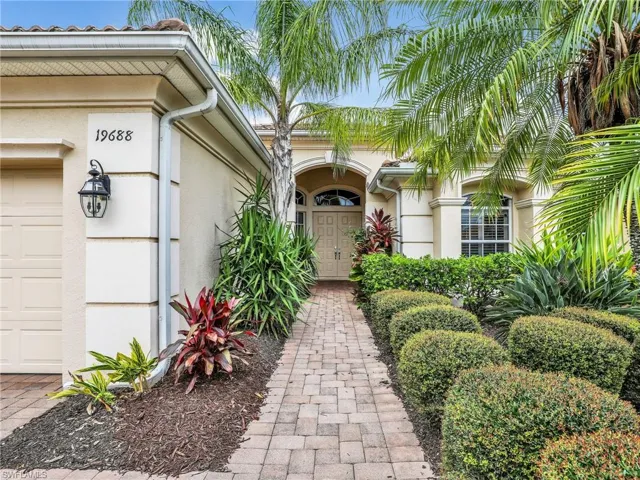 Entrance to property with stucco siding