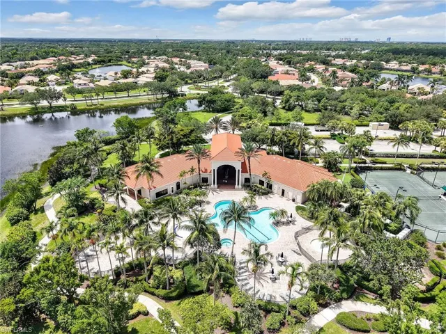 View of property location featuring a pool and a nearby body of water