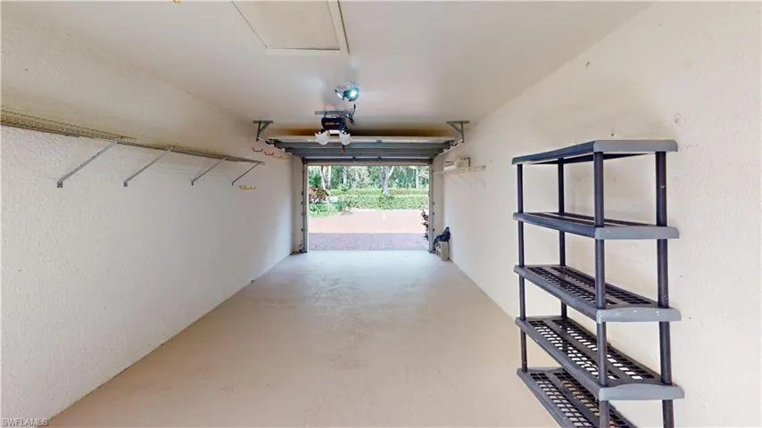 Garage featuring a garage door opener