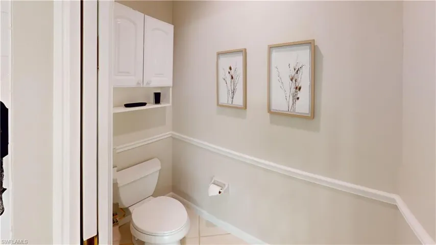 Bathroom featuring tile patterned floors and toilet