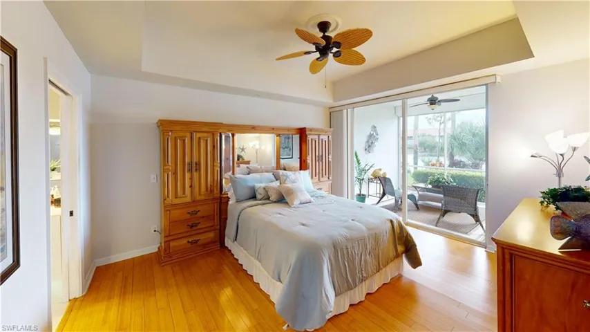 Bedroom featuring access to exterior, ceiling fan, and light hardwood / wood-style flooring