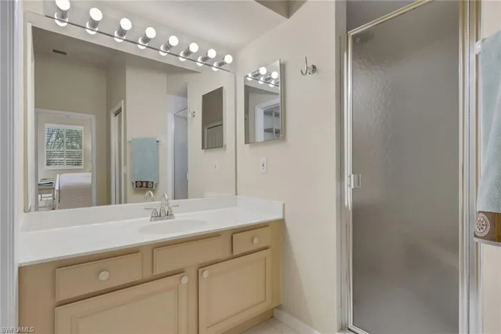 Bathroom with vanity and a stall shower