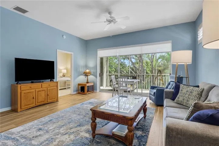Living room with entry to primary bedroom