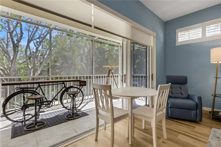 Lanai with window framing huge oak tree