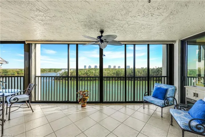 Water Every Where!!  Stunning Views featuring expansive windows, a water view, plenty of natural light, tile patterned floors, and a textured ceiling