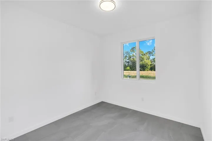 Spare room with baseboards