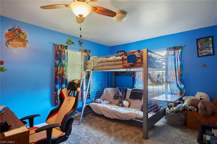 Bedroom with carpet flooring and a ceiling fan