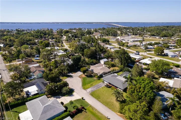 Drone / aerial view with a water view and a residential view