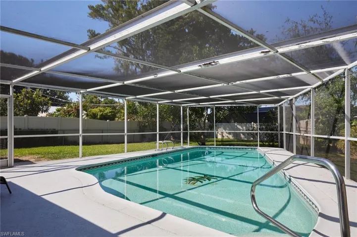 View of swimming pool with a patio area, a fenced backyard, a fenced in pool, and a lanai