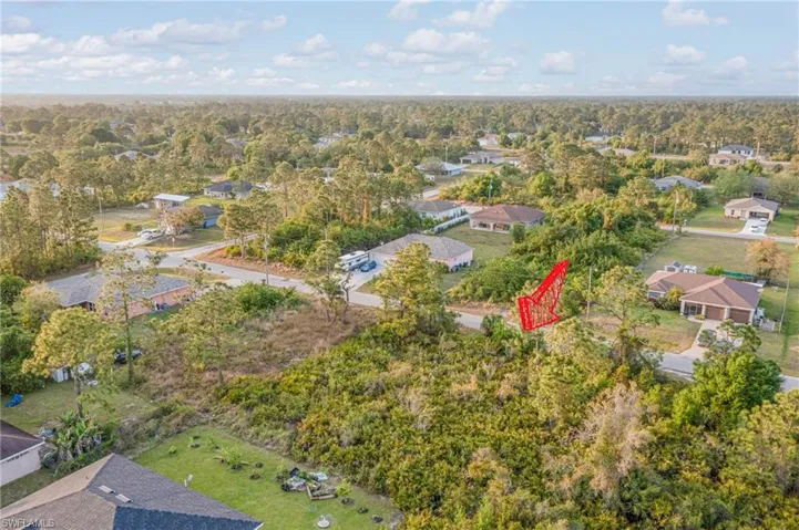 Bird's eye view with a residential view and a wooded view