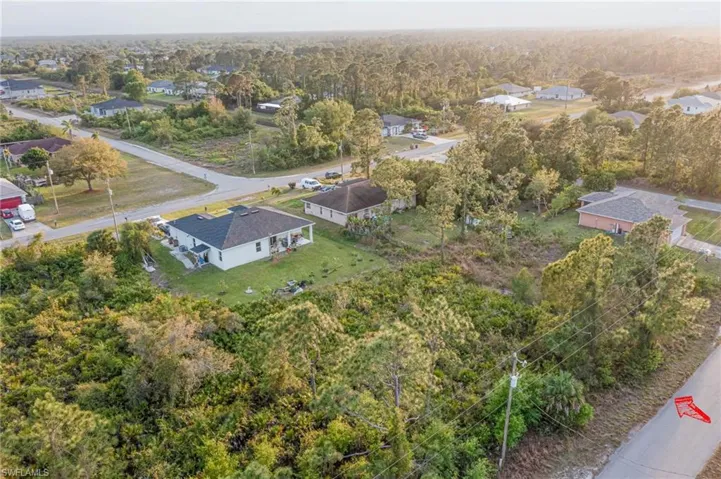 Aerial view featuring a forest view