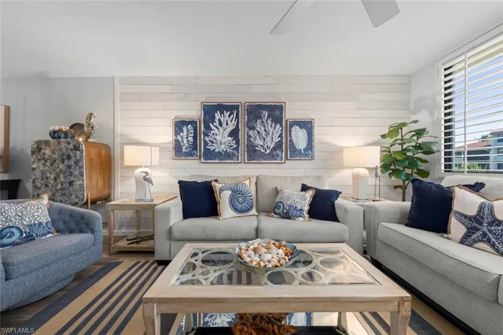 Horizontal wood-plank accent wall and white-finished plantation shutter blinds