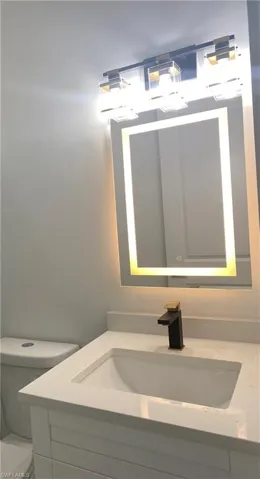 Bathroom featuring vanity and toilet