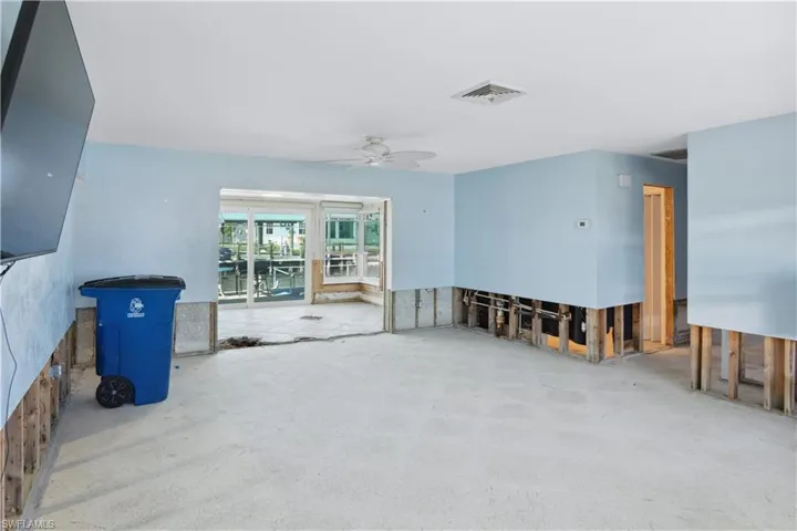 Living Room looking into sun room to screened in patio