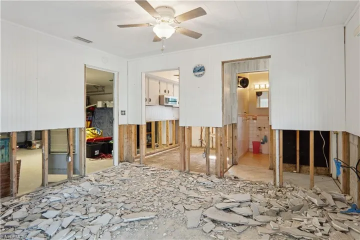 dining room area. garage on left, kitchen forward left, 2nd bathroom/pool bathroom on right
