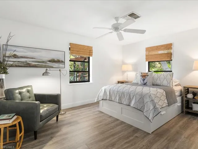 Bedroom featuring LVP floors, baseboards, and ceiling fan
