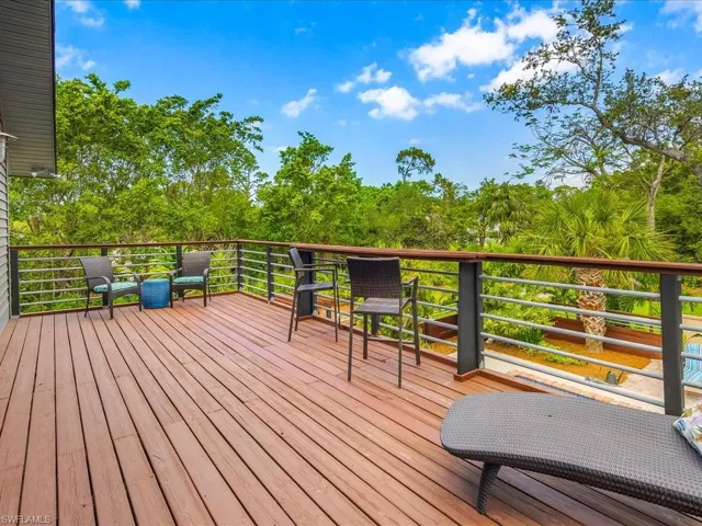 View of wooden terrace off primary bedroom