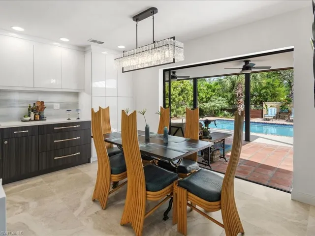 Dining room with view of pool