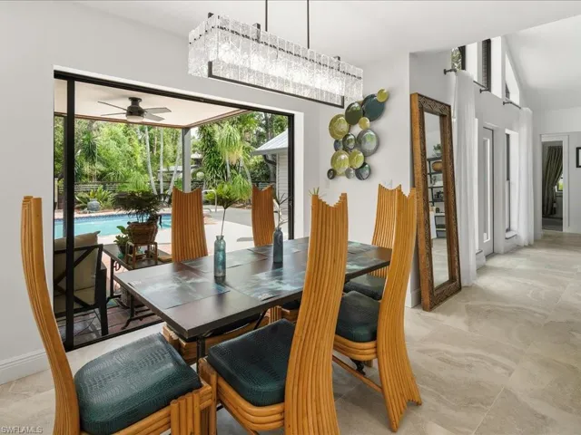 Dining room featuring a large light fixture over the dining table