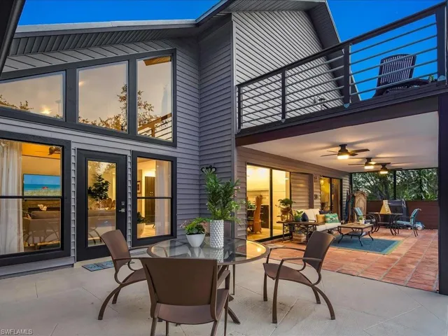 View of patio featuring outdoor dining space and a ceiling fan