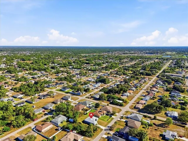 Aerial overview of property's location featuring nearby suburban area