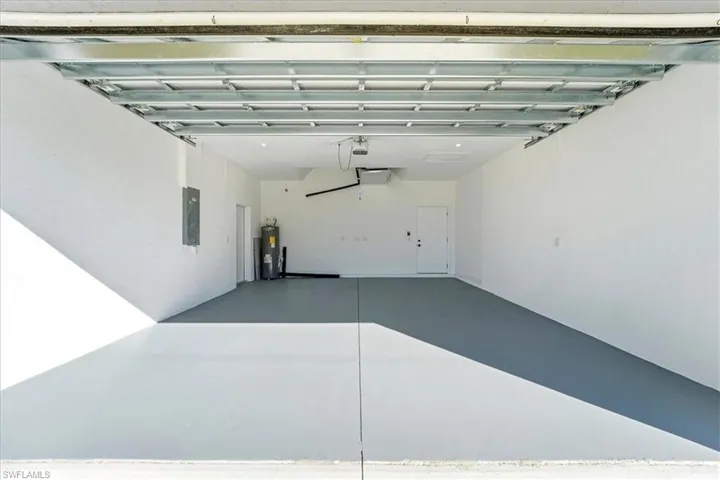 Garage with electric panel and water heater