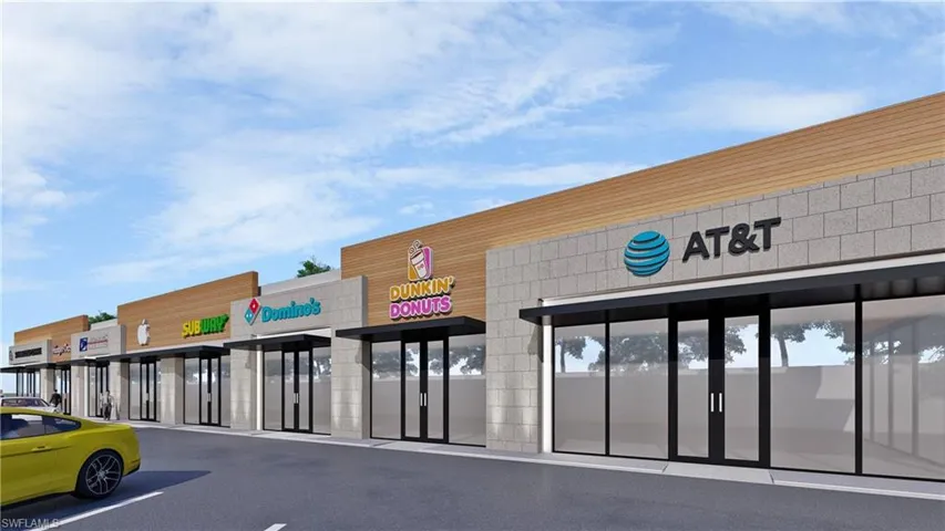 View of commercial location with uncovered parking