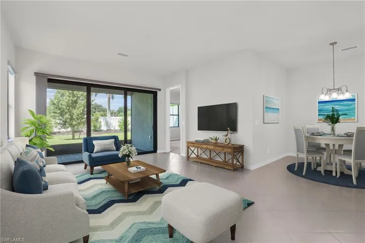 Virtually staged photo of the main living area off of the kitchen and dining area.