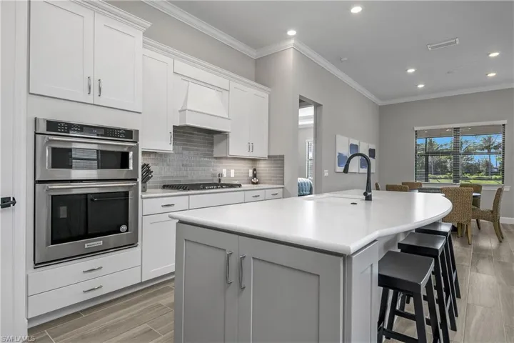 You'll enjoy plenty of room for entertaining guests with an oversized kitchen island, a kitchen cafe area, and an additional dining space.