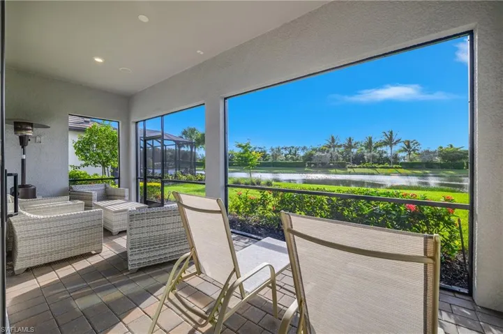 Relax and unwind at the end of the day on this spacious screened lanai with western views overlooking the water and beautifully landscaped spaces.