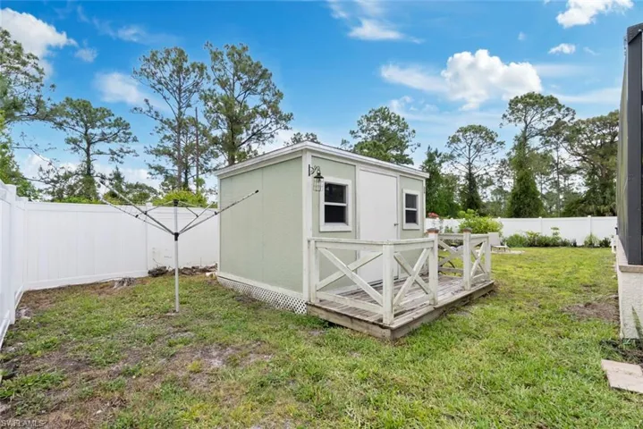 View of shed featuring a fenced backyard