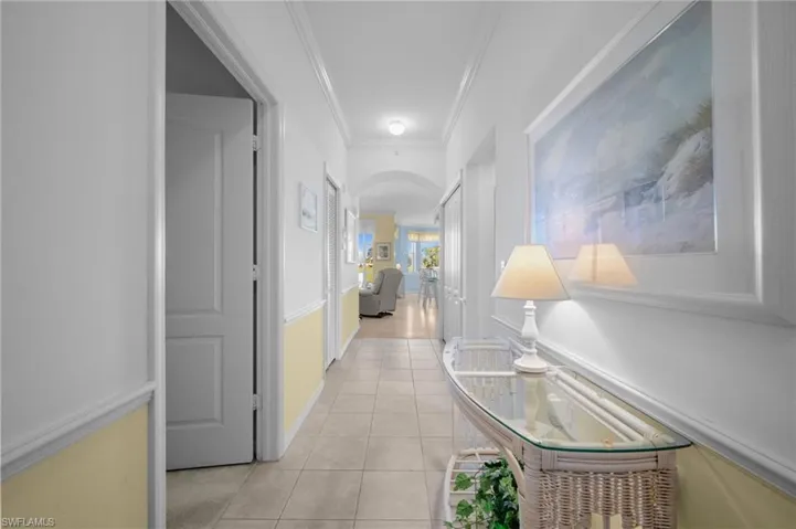 Bedroom with light colored carpet and a ceiling fan