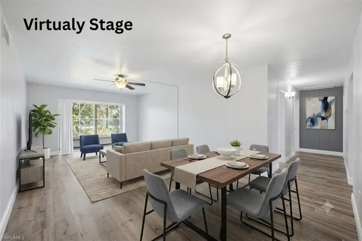 Open-concept living and dining area featuring wood-finish flooring