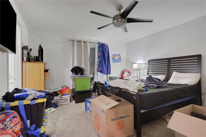 Bedroom featuring carpet flooring and a ceiling fan
