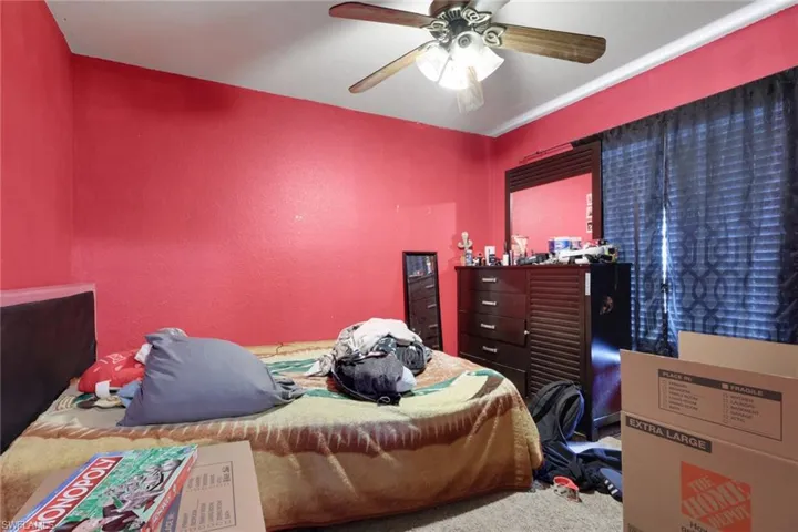 Bedroom featuring ceiling fan and carpet flooring