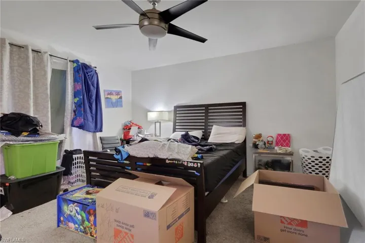 Bedroom with carpet floors and a ceiling fan
