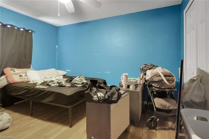 Bedroom featuring light wood-style floors and ceiling fan