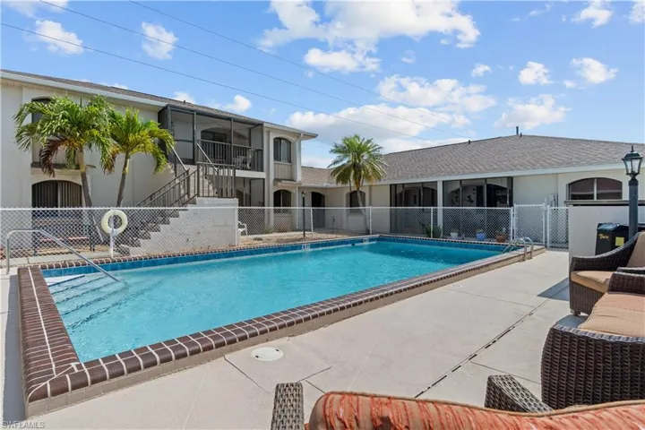 Community pool with stairway and a patio